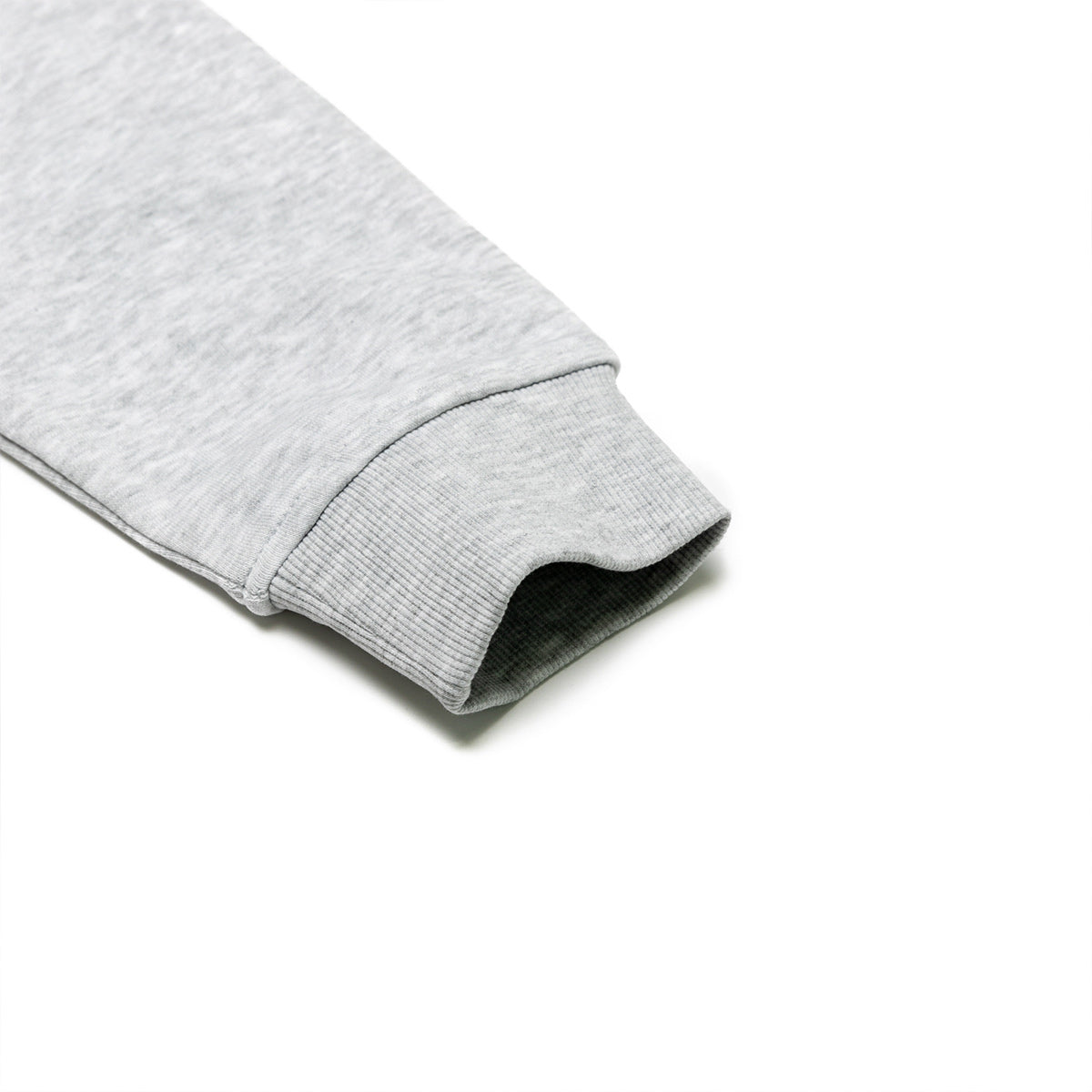 Close-up of a gray hoodie sleeve on a white background
