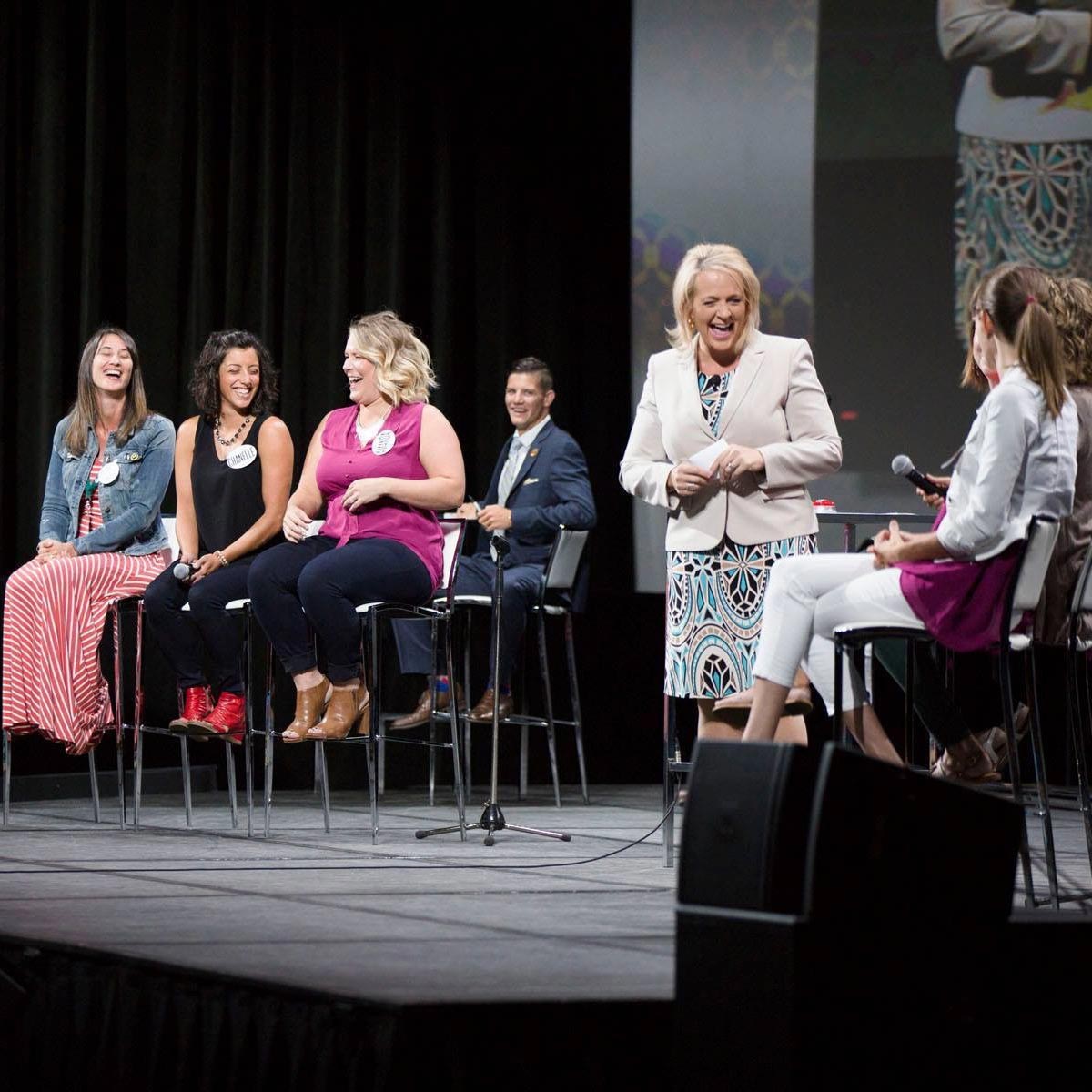 Panel discussion with speakers on a stage