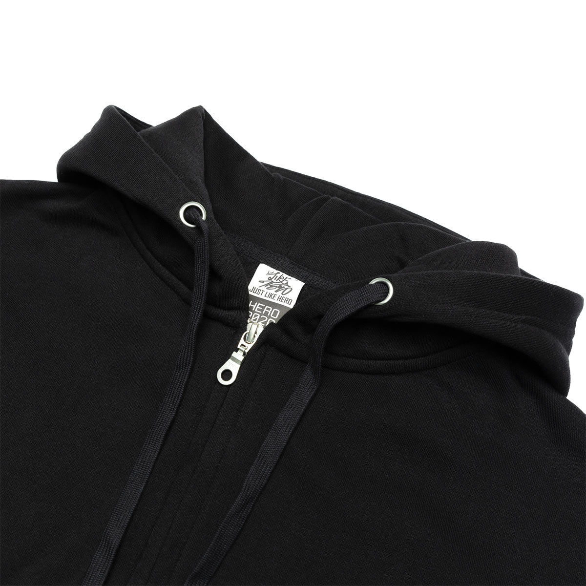 Close-up of a black hoodie with a brand tag on a white background