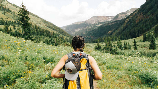 A woman hiking in a mountain valley