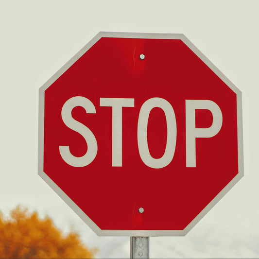 Red stop sign with a blurred background